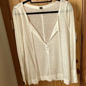 White semi sheer long sleeve. We The Free. Size m No tears pulls or pilling.